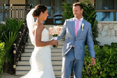 Brian Hollins and Carli Lloyd in their wedding dress ahead of their big day in Mexico